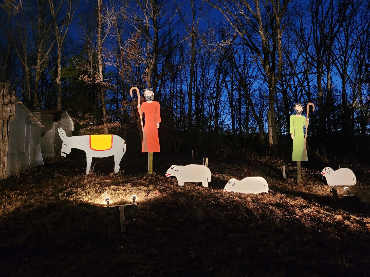 It's almost night when the lights come on at the Community Betterment Association's hilltop Nativity scene in Meta.